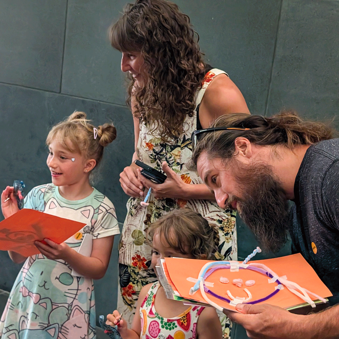 A family examines one of Margaret Craig's Setting Seed sculptures during McNay Family Day at the McNay Art Museum in San Antonio.